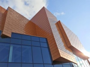 Orange aluminium cladding in shingle format