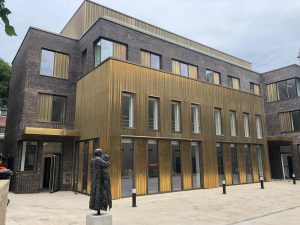 Brass coloured metal clad residential building in Hackney London RCI Magazine Facade Awards 2021!