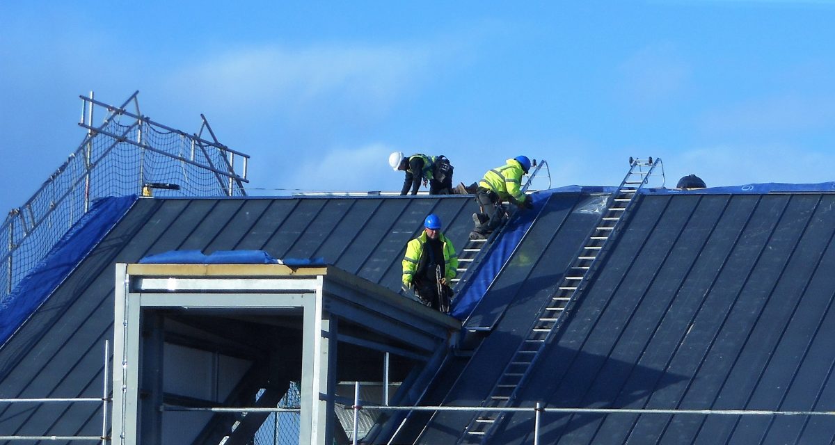 Zinc Roofing and Cladding 4. Longworth Dumfries & Galloway Hospital, zinc operatives installing 10m sections of NedZinc Nova standing seam off Cat ladders fixed to custom hook-on point