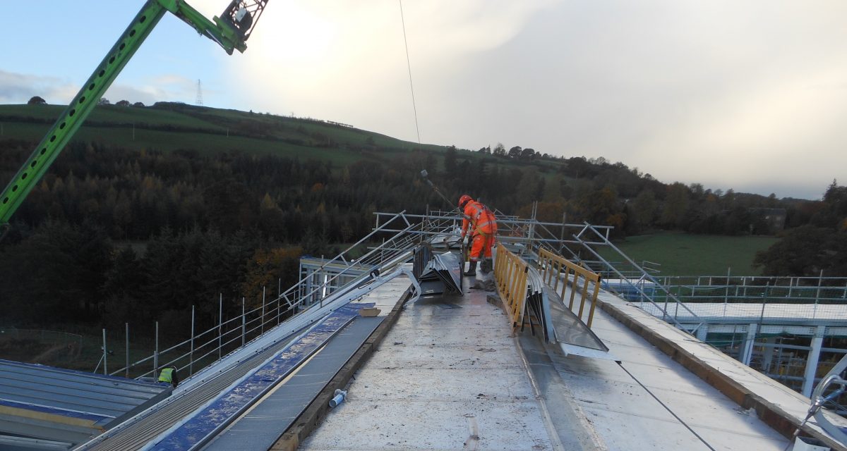 Zinc Roofing and Cladding 6. Longworth Dumfries & Galloway Hospital, zinc operative harnessed to bespoke mansafe line with Cat lader on custom hook-on point