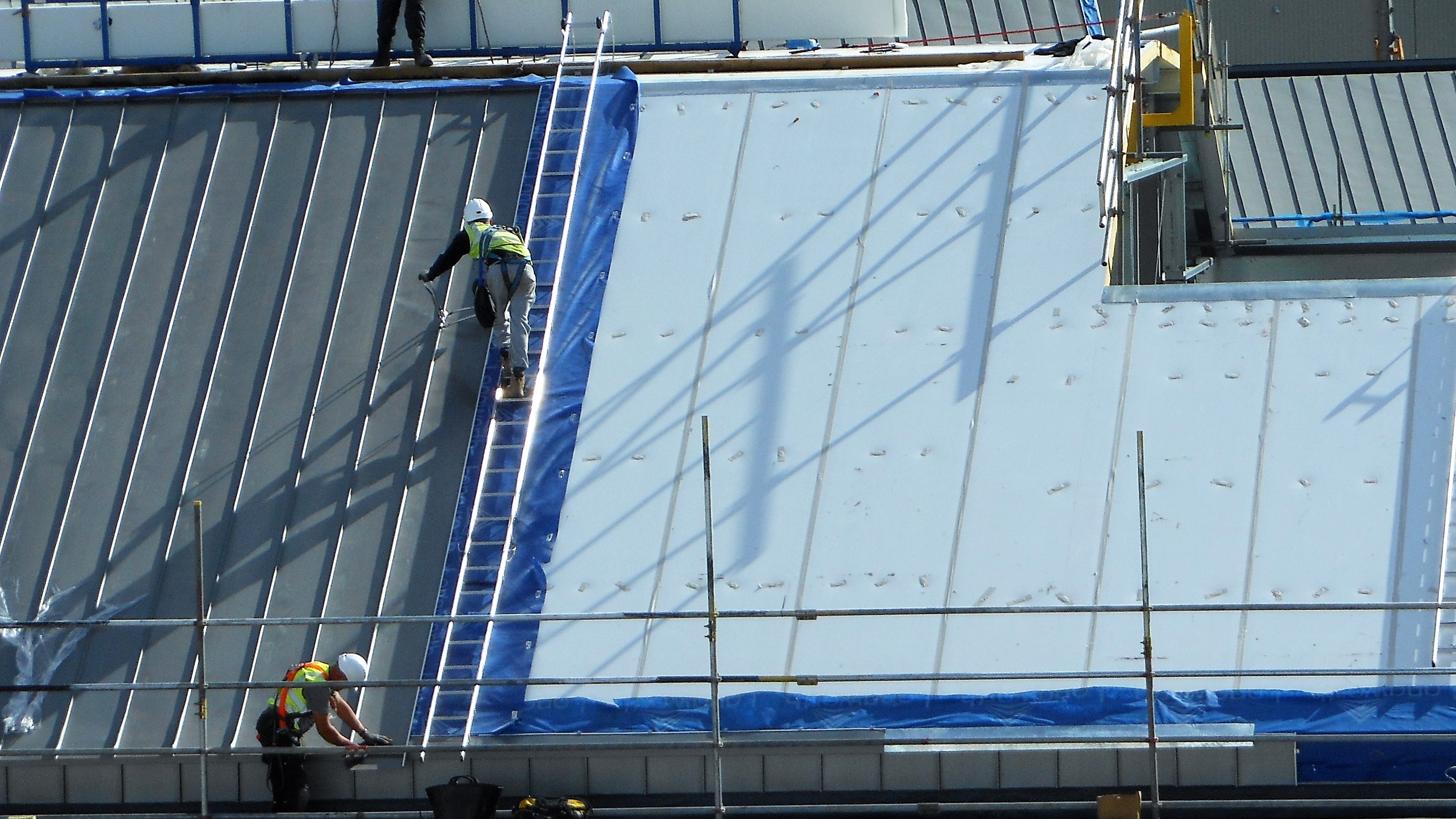 Zinc Roofing and Cladding Longworth Dumfries & Galloway Hospital, difficult left handed standing seam hand crimping on inertia reel.