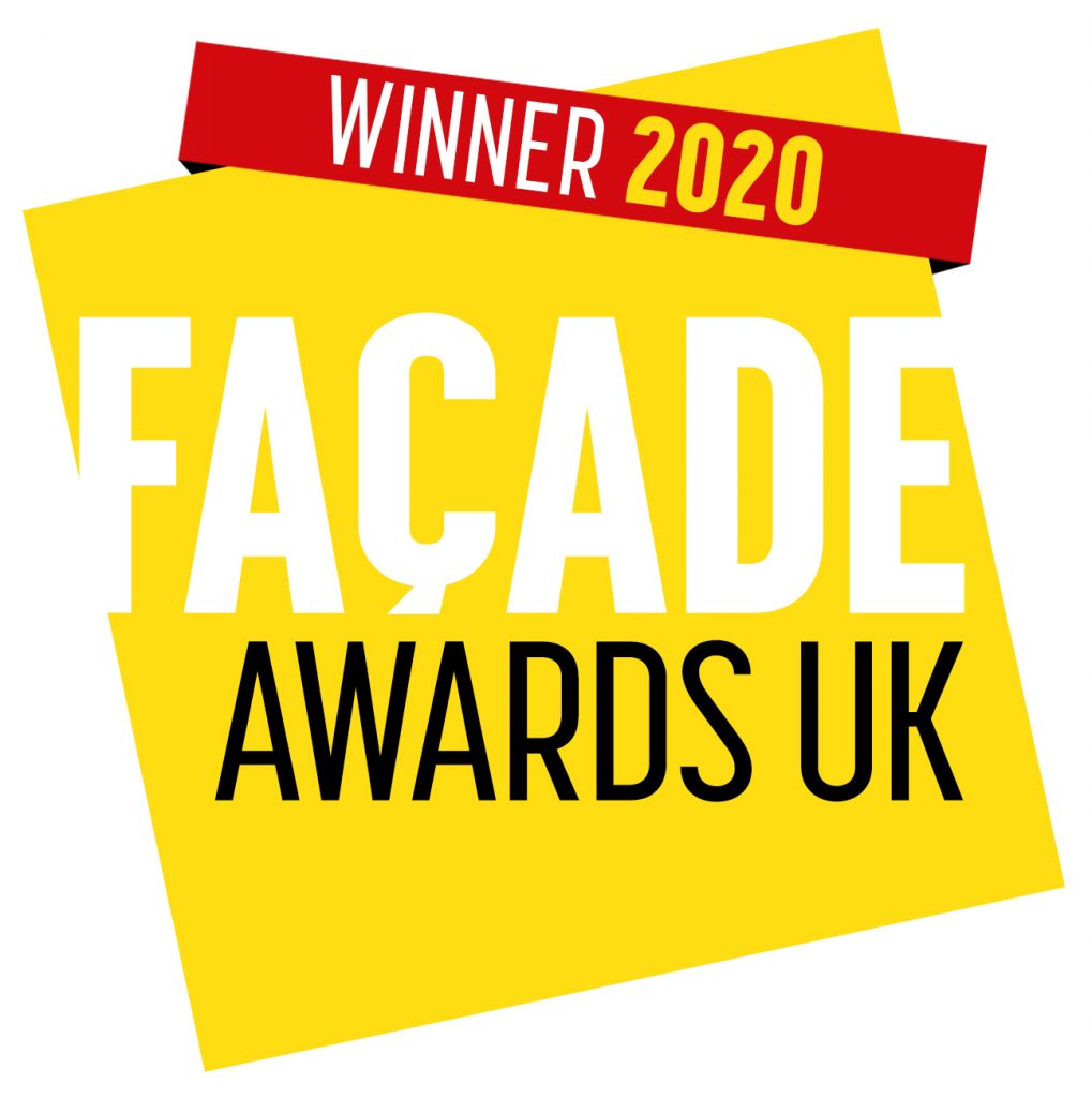 Winners logo for facade awards. yellow square with red sash across